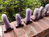 5-7" tall. Pure Grade A Amethyst Cluster on wooden stand from Brazil. 