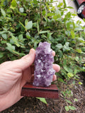 5-7" tall. Pure Grade A Amethyst Cluster on wooden stand from Brazil. 