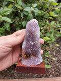 5-7" tall. Pure Grade A Amethyst Cluster on wooden stand from Brazil. 
