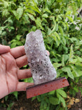 5-7" tall. Pure Grade A Amethyst Cluster on wooden stand from Brazil. 