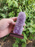 5-7" tall. Pure Grade A Amethyst Cluster on wooden stand from Brazil. 