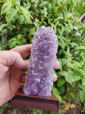 5-7" tall. Pure Grade A Amethyst Cluster on wooden stand from Brazil. 