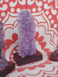 5-7" tall. Pure Grade A Amethyst Cluster on wooden stand from Brazil. 