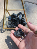 Premium Grade AA Naturally Tumbled Apache Tears from Arizona. Natural and untreated. About 1 inch wide each. Irregular oval shapes.
