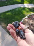 Premium Grade AA Naturally Tumbled Apache Tears from Arizona. Natural and untreated. About 1 inch wide each. Irregular oval shapes.